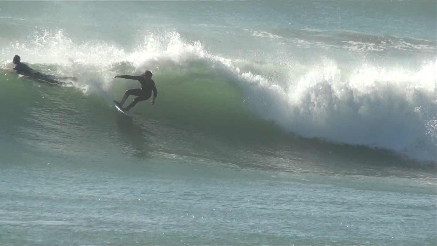 Surfing at sunset during Weekend Escape package